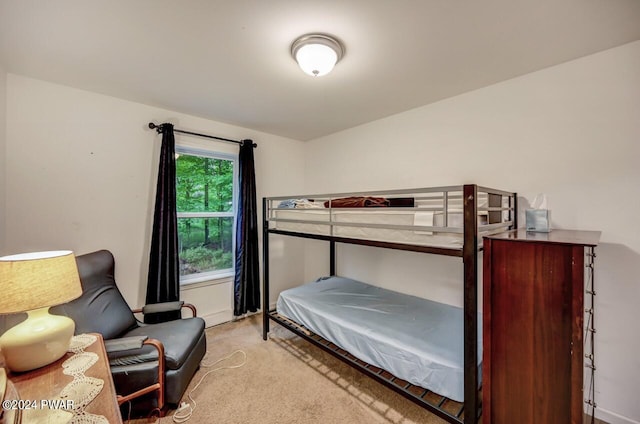 bedroom featuring light colored carpet