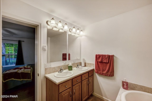 bathroom with vanity, a tub to relax in, and tile patterned floors