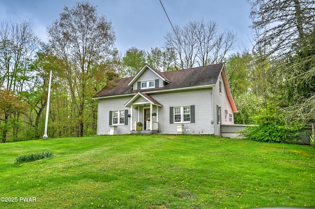 162 Plank Rd, Beach Lake, PA 18405 - view of front of property featuring a front lawn, a chimney, and roof with shingles