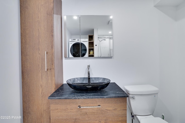 439 Gold Finch Rd, Bushkill, PA 18324 - bathroom featuring washer / clothes dryer, vanity, and toilet