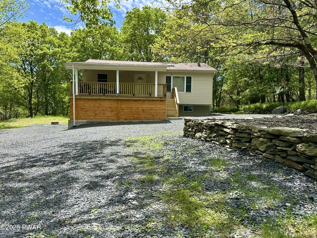 439 Gold Finch Rd, Bushkill, PA 18324 - view of front facade with stairs and a porch