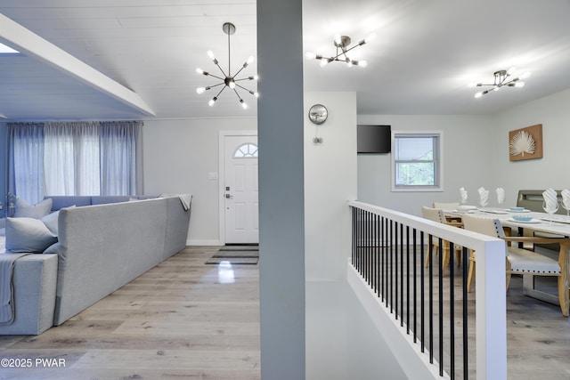 439 Gold Finch Rd, Bushkill, PA 18324 - living room with a chandelier, wood finished floors, and baseboards