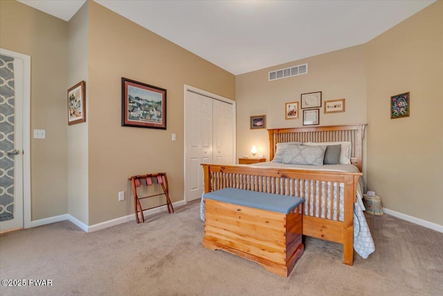 bedroom featuring visible vents, baseboards, a closet, and carpet flooring