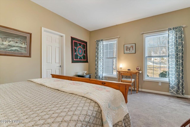 bedroom with baseboards and carpet