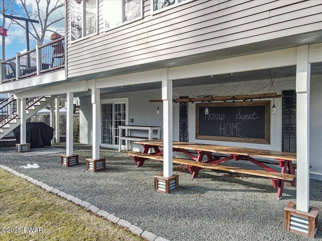 view of home's community featuring stairway