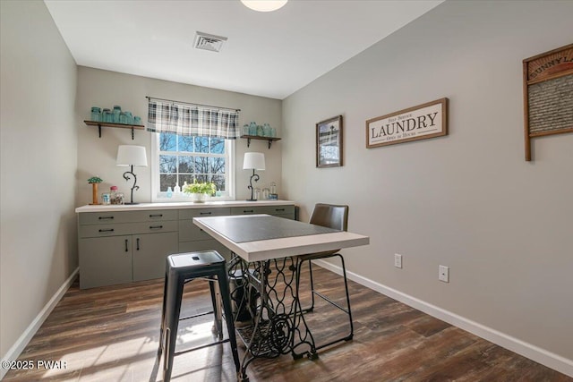 kitchen with dark wood finished floors, visible vents, and open shelves