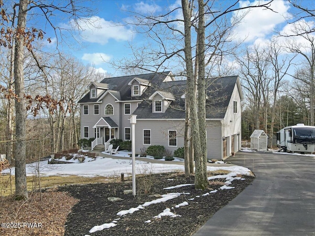 view of front of home featuring driveway and a garage