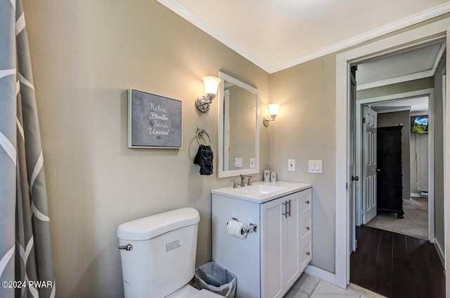 bathroom featuring hardwood / wood-style floors, vanity, toilet, and ornamental molding