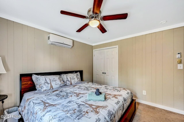 carpeted bedroom with a wall mounted air conditioner, ceiling fan, ornamental molding, and a closet