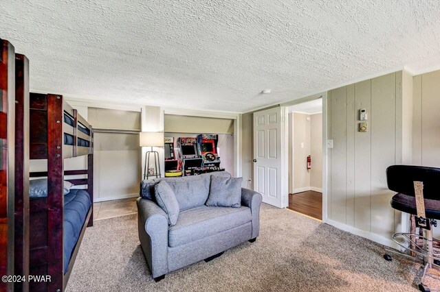 bedroom with carpet flooring and a textured ceiling