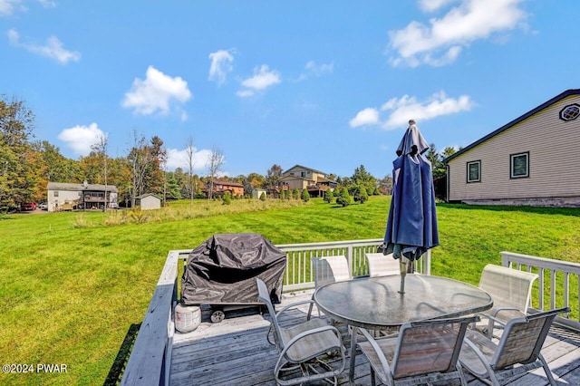 deck featuring a yard and area for grilling