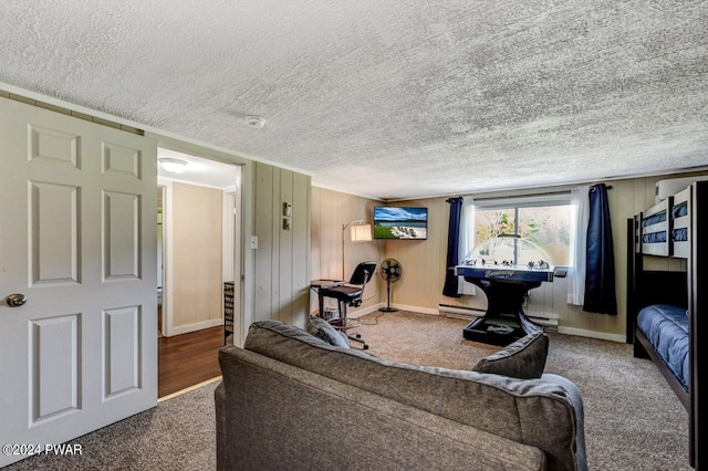 living room with a textured ceiling, carpet floors, and wooden walls