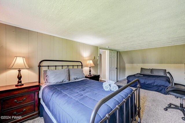 carpeted bedroom featuring a textured ceiling