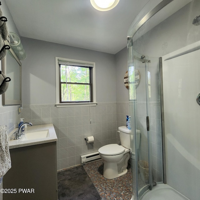 101 Deer Run, Greentown, PA 18451 - full bath with tile walls, baseboard heating, a stall shower, vanity, and wainscoting