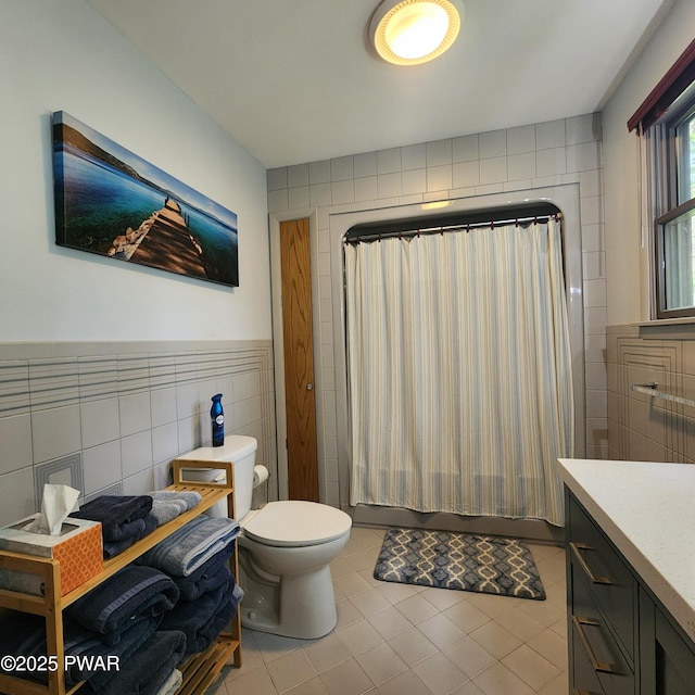 101 Deer Run, Greentown, PA 18451 - bathroom featuring tile walls, tile patterned floors, vanity, and shower / bath combo with shower curtain