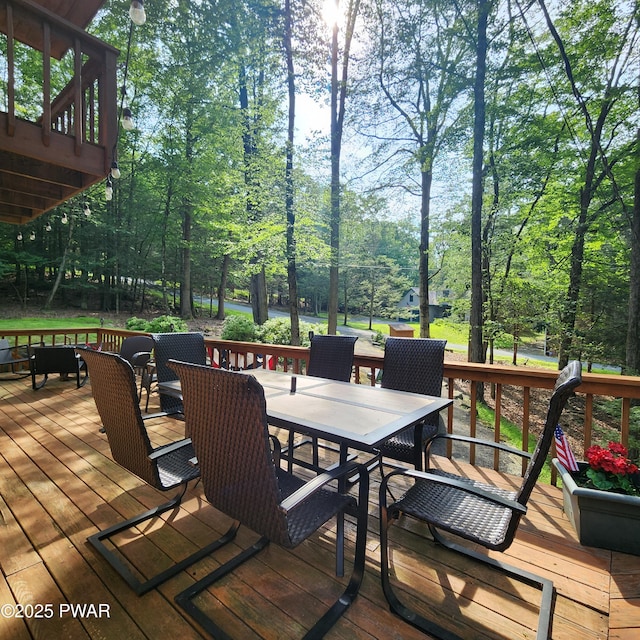 101 Deer Run, Greentown, PA 18451 - wooden terrace with outdoor dining area and view of scattered trees