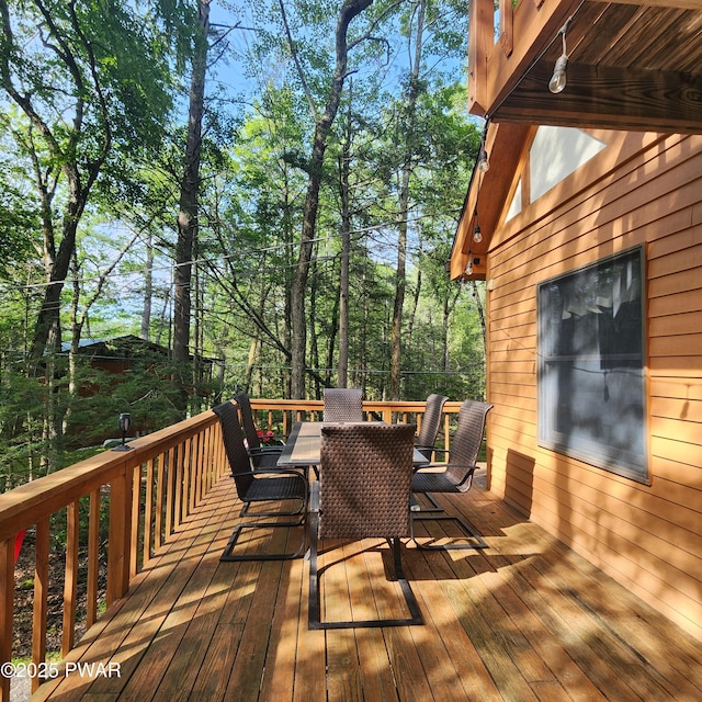 101 Deer Run, Greentown, PA 18451 - wooden deck featuring outdoor dining area and view of wooded area