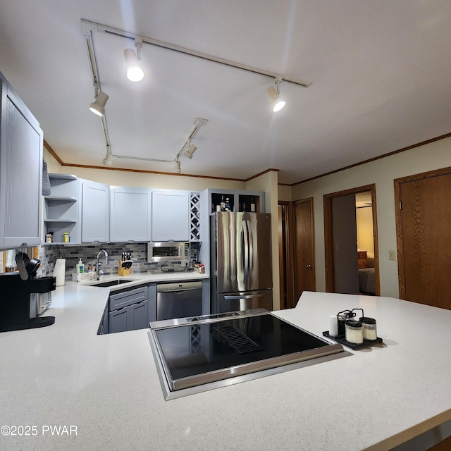 101 Deer Run, Greentown, PA 18451 - kitchen with appliances with stainless steel finishes, track lighting, open shelves, light countertops, and decorative backsplash