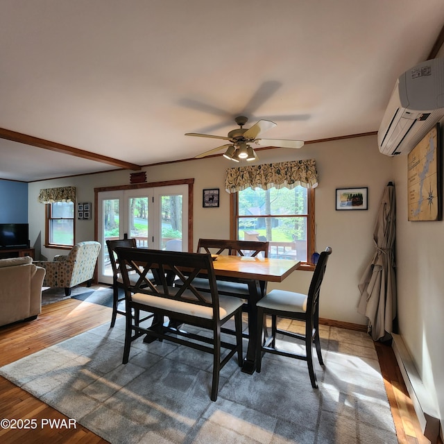 101 Deer Run, Greentown, PA 18451 - dining space featuring a wall mounted air conditioner, wood finished floors, baseboard heating, and ceiling fan