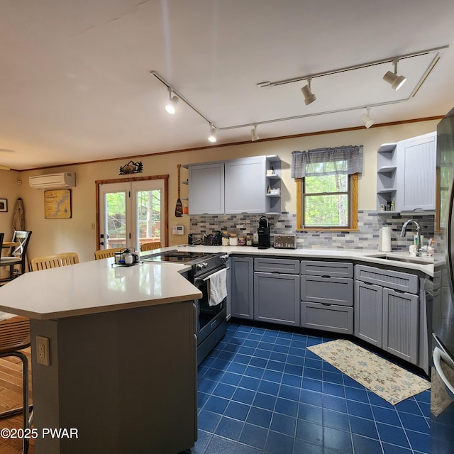 101 Deer Run, Greentown, PA 18451 - kitchen featuring open shelves, electric range oven, a peninsula, and track lighting