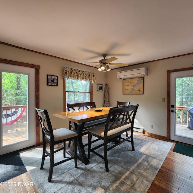 101 Deer Run, Greentown, PA 18451 - dining space with a wall mounted AC, plenty of natural light, light wood-style floors, and ornamental molding