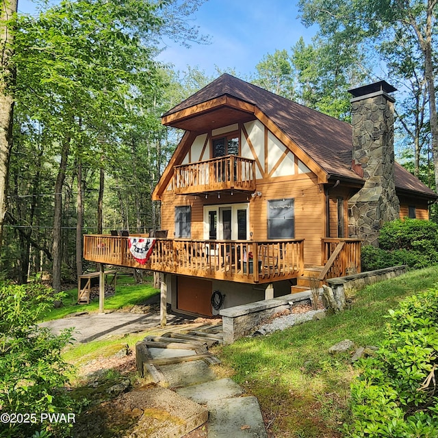101 Deer Run, Greentown, PA 18451 - view of front of property with a wooden deck, a balcony, roof with shingles, and french doors