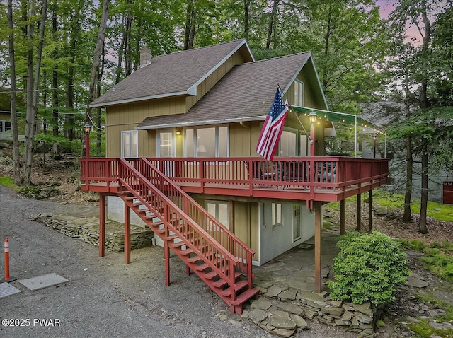 1474 Lakeland Dr, Lake Ariel, PA 18436 - view of front facade with roof with shingles, a wooden deck, a chimney, and stairway