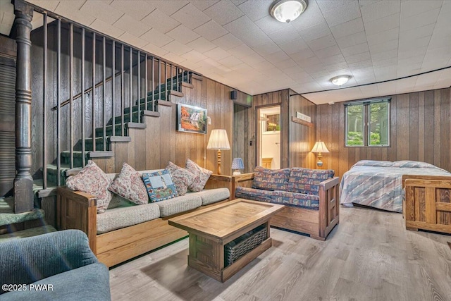 1474 Lakeland Dr, Lake Ariel, PA 18436 - living room with wood walls, stairs, and wood finished floors