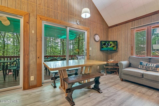 1474 Lakeland Dr, Lake Ariel, PA 18436 - dining area featuring vaulted ceiling, wooden walls, healthy amount of natural light, and wood finished floors