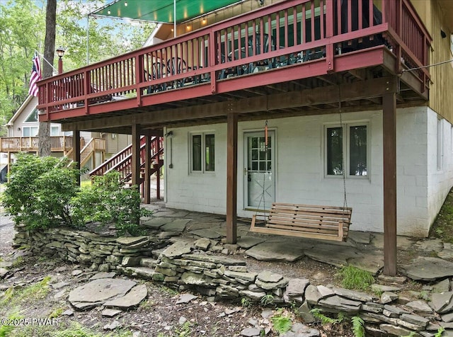 1474 Lakeland Dr, Lake Ariel, PA 18436 - back of property with concrete block siding, a deck, and stairway