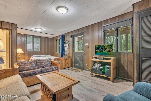 1474 Lakeland Dr, Lake Ariel, PA 18436 - living room featuring plenty of natural light, wooden walls, and wood finished floors