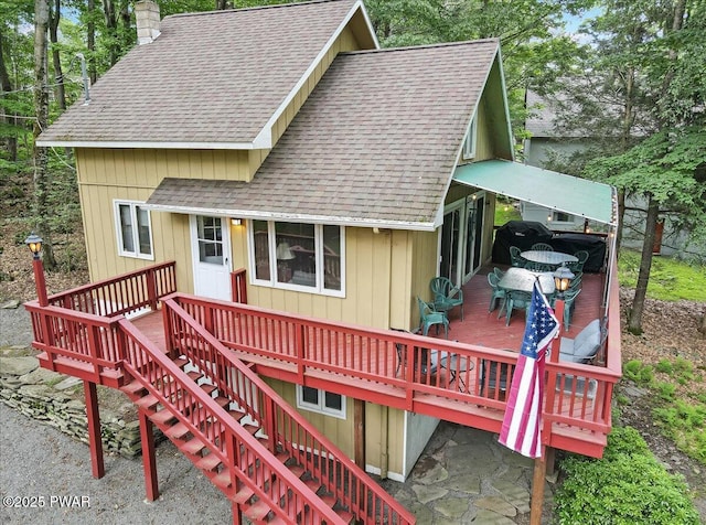 1474 Lakeland Dr, Lake Ariel, PA 18436 - view of front of home with roof with shingles, a deck, stairway, and a chimney
