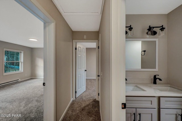 bathroom with vanity and a baseboard heating unit