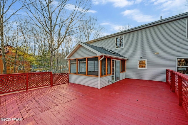 wooden deck featuring a sunroom