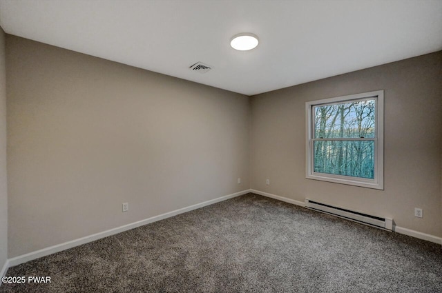 spare room featuring a baseboard radiator and carpet