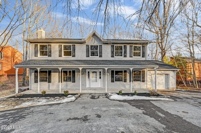 view of front of home featuring a garage and covered porch