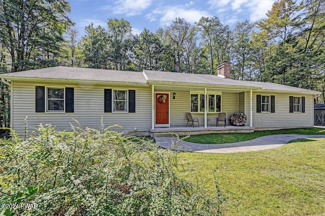 single story home with a porch and a front yard