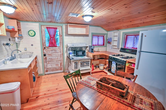 121 Ness Rd, Dingmans Ferry, PA 18328 - kitchen featuring white appliances, open shelves, wooden walls, light wood finished floors, and light countertops