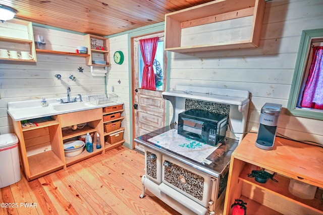 121 Ness Rd, Dingmans Ferry, PA 18328 - kitchen with open shelves, wood ceiling, light wood-style floors, wooden walls, and light countertops