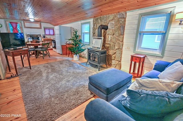 121 Ness Rd, Dingmans Ferry, PA 18328 - living area featuring a wood stove, vaulted ceiling, plenty of natural light, hardwood / wood-style flooring, and wooden ceiling