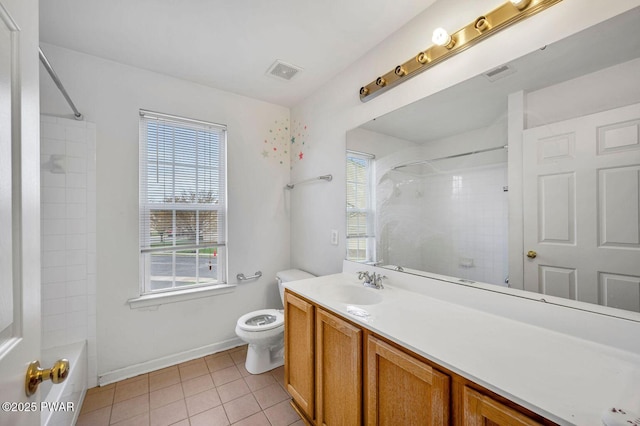 bathroom featuring toilet, tile patterned floors, vanity, and visible vents