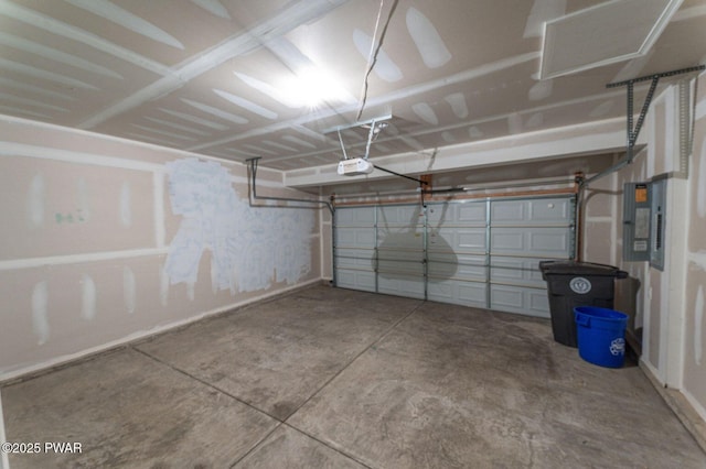 garage featuring a garage door opener and electric panel
