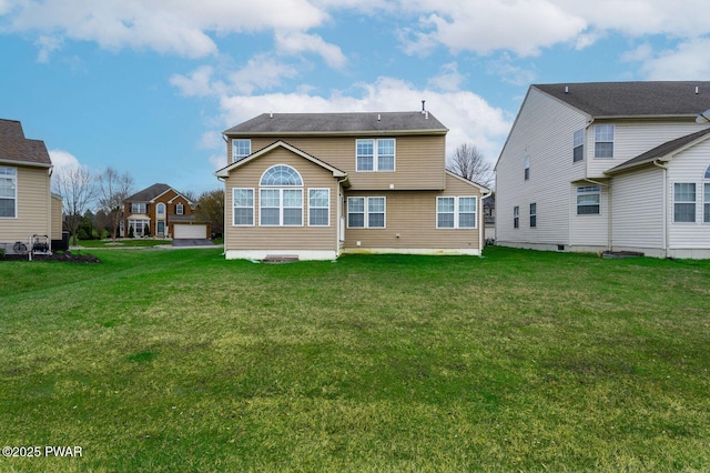 rear view of house with a lawn