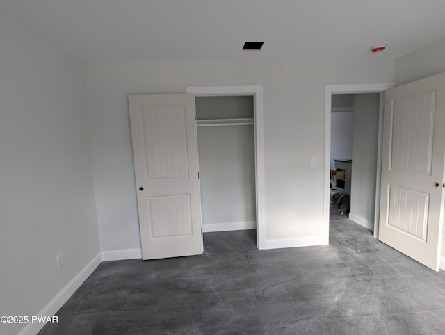 unfurnished bedroom with a closet