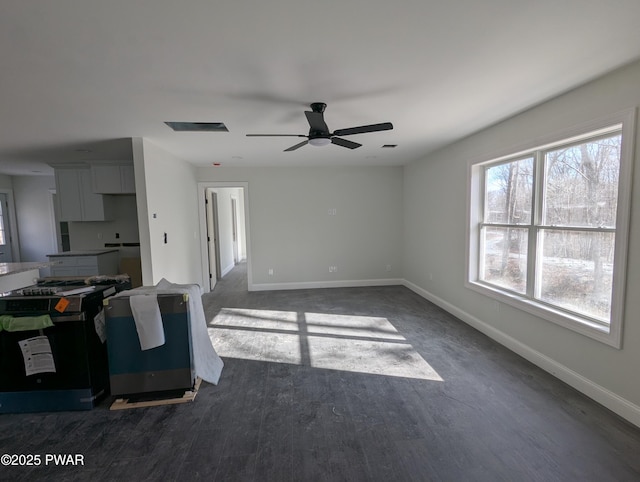 living room featuring ceiling fan and dark hardwood / wood-style floors