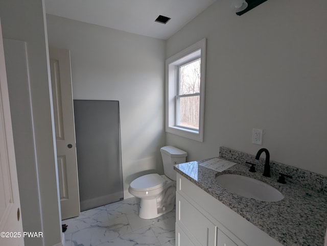 bathroom with vanity and toilet