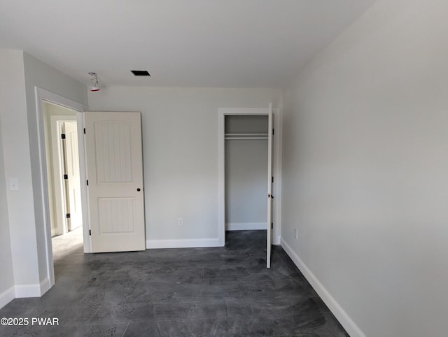 unfurnished bedroom featuring a closet