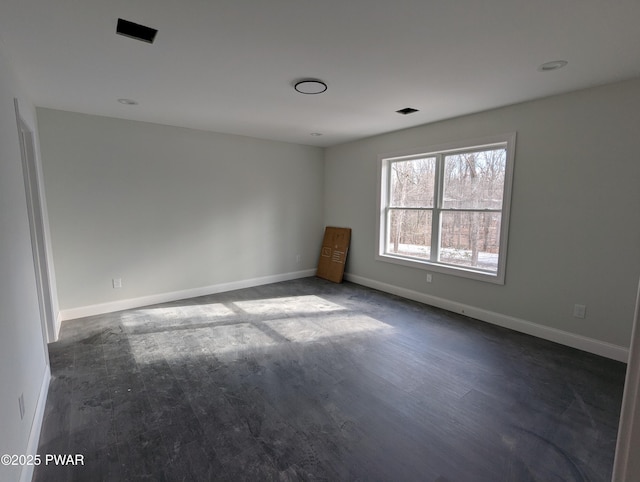 empty room featuring dark hardwood / wood-style floors