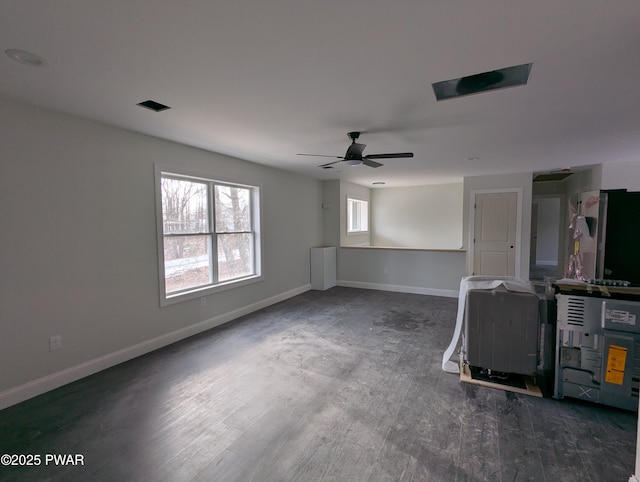 unfurnished room featuring ceiling fan and dark wood-type flooring