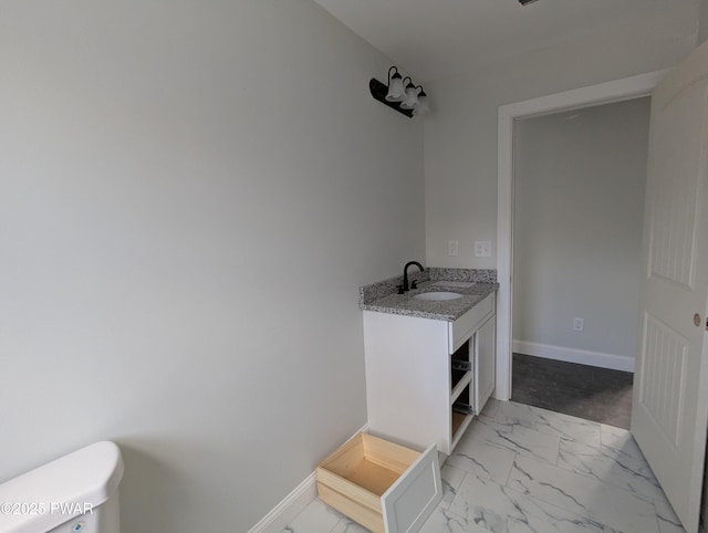 bathroom with vanity and toilet